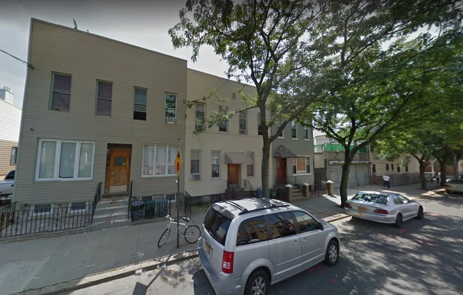 2014 Bleecker Street — Street-level view of the building before and after the facade transformation. — before