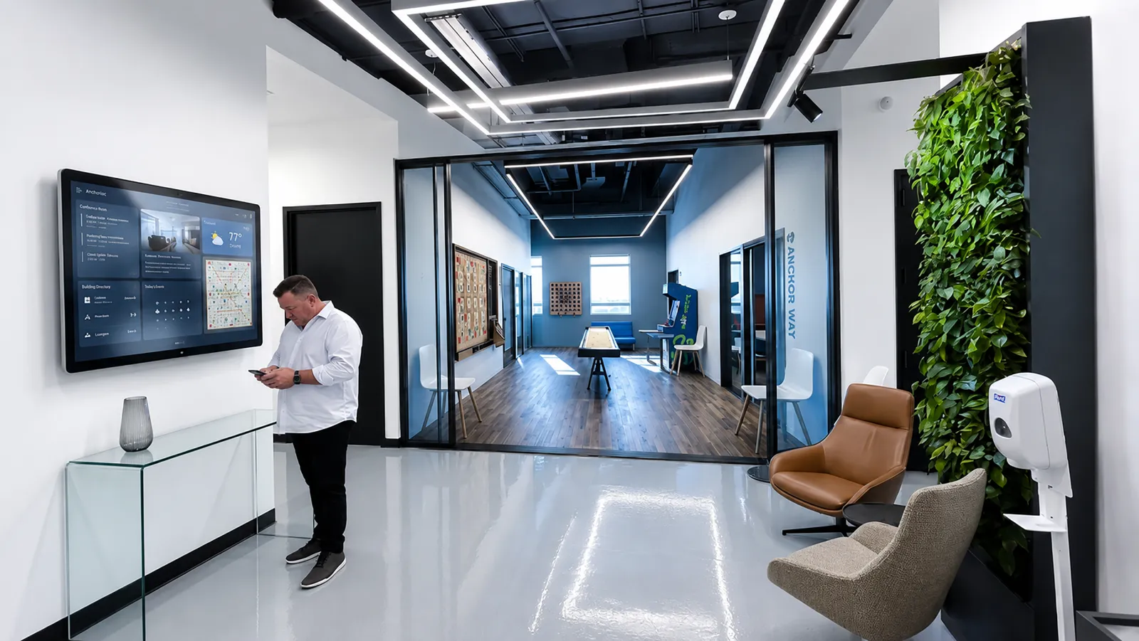 353 West Street — A design-build office fit-out for Motivate at Pier 40, featuring a living green wall, glass-walled phone booths, and a playful amenity lounge.
