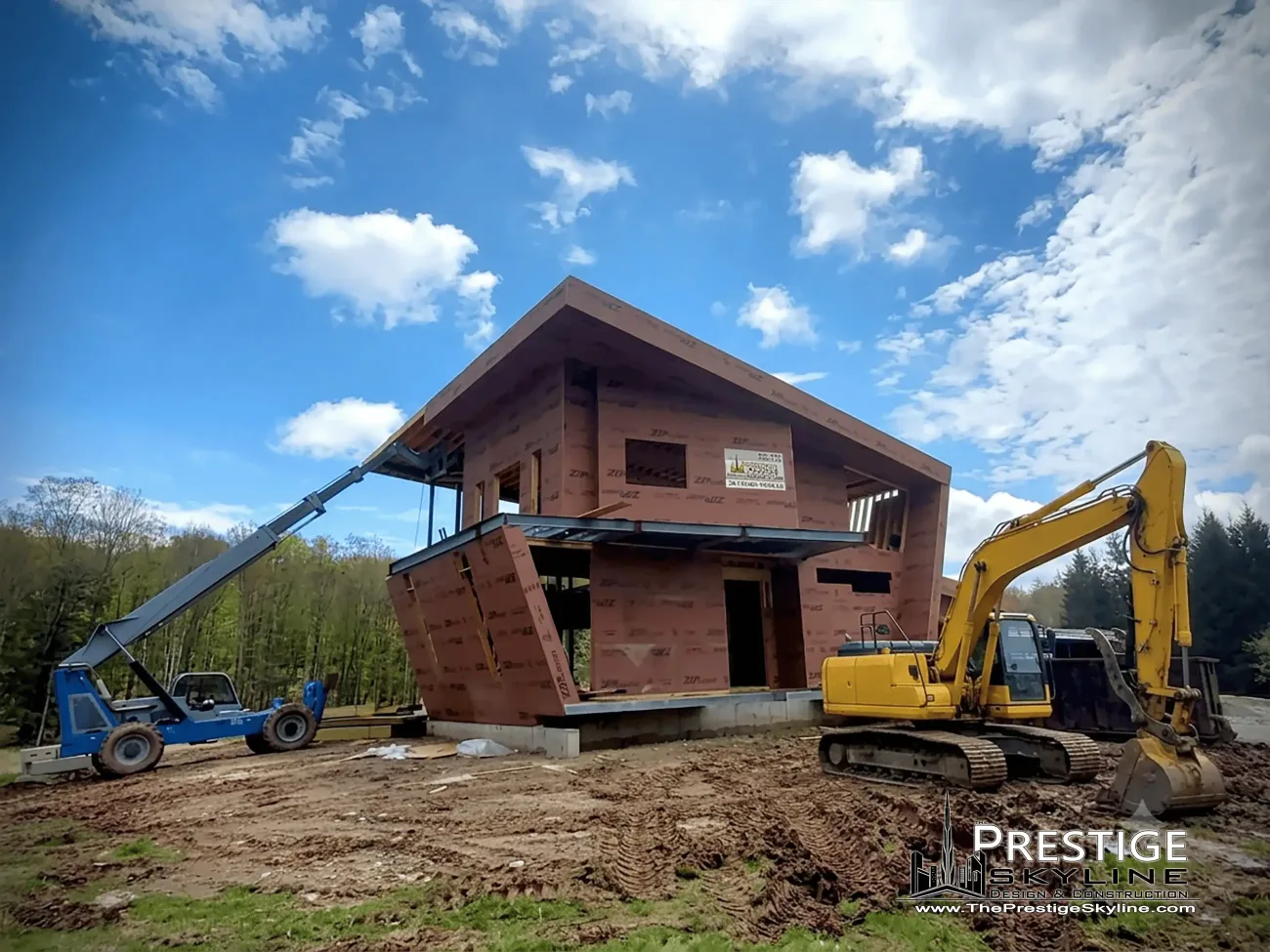 Custom luxury home under construction with crane and excavator on a Prestige Skyline residential build